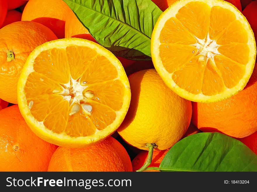 Sliced oranges in orange background. Sliced oranges in orange background.