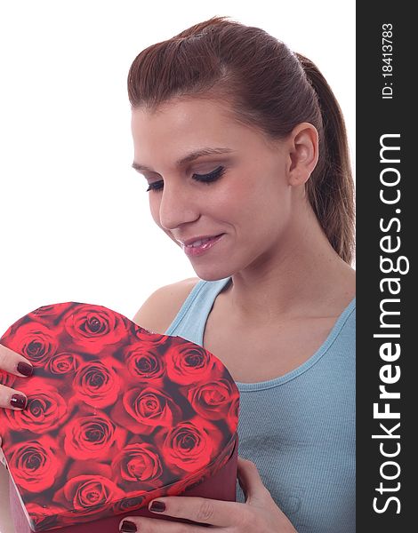 Sexy woman with heart shaped present surprised