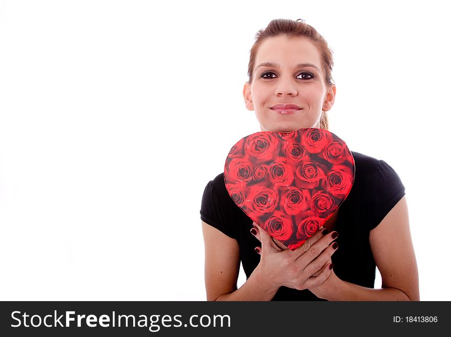 woman with heart shaped present surprised. woman with heart shaped present surprised