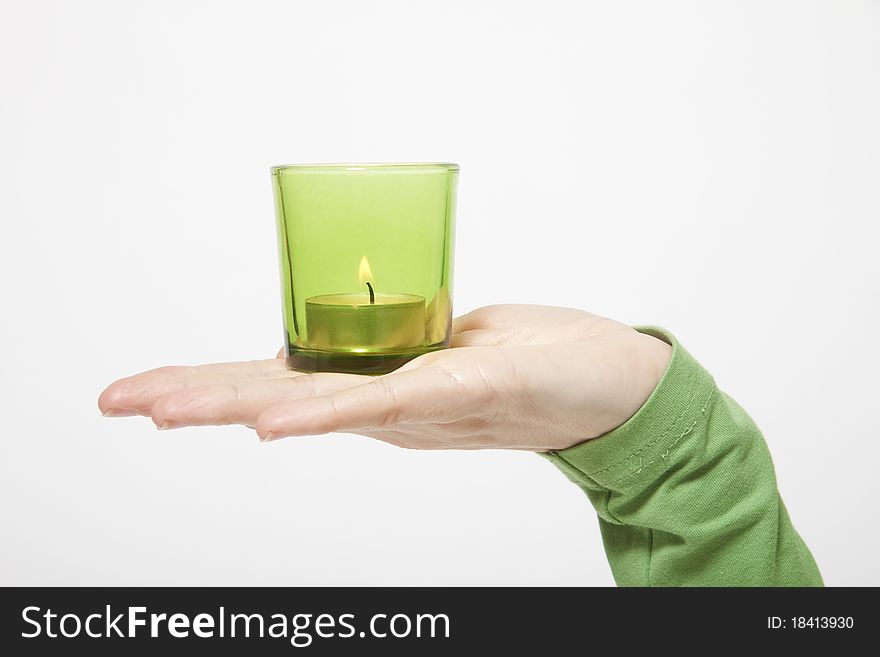Hand with candle on white background