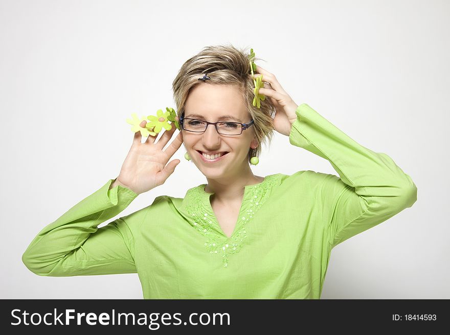 Portrait of attractive woman with green flowers on white background. Portrait of attractive woman with green flowers on white background