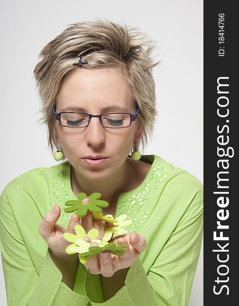 Portrait of attractive woman with green flowers on white background. Portrait of attractive woman with green flowers on white background