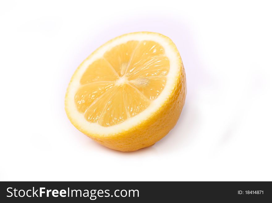 Half of lemon isolated on the white