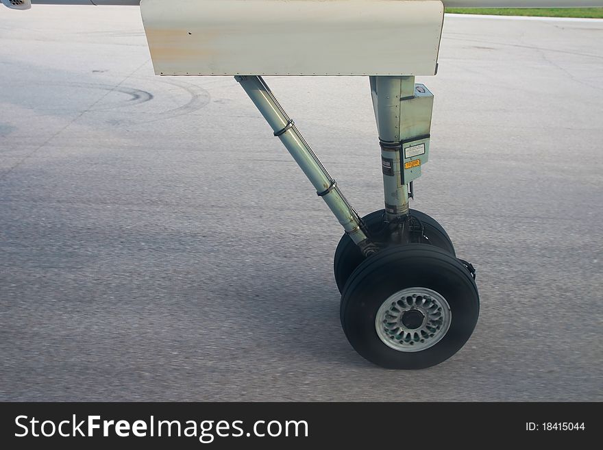 Aeroplane wheel static on runway.