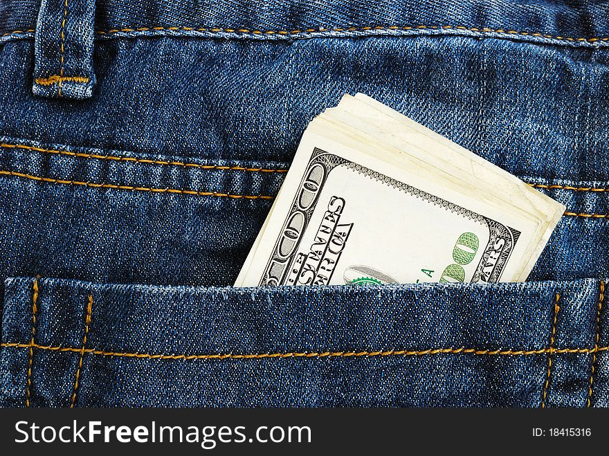 Lot of dollars in a pocket of jeans.