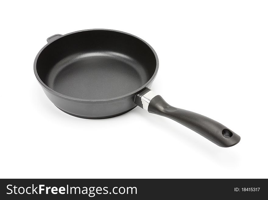 Frying pan with the handle on a white background