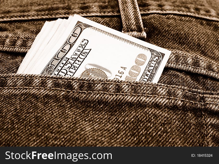 Lot of dollars in a pocket of jeans.