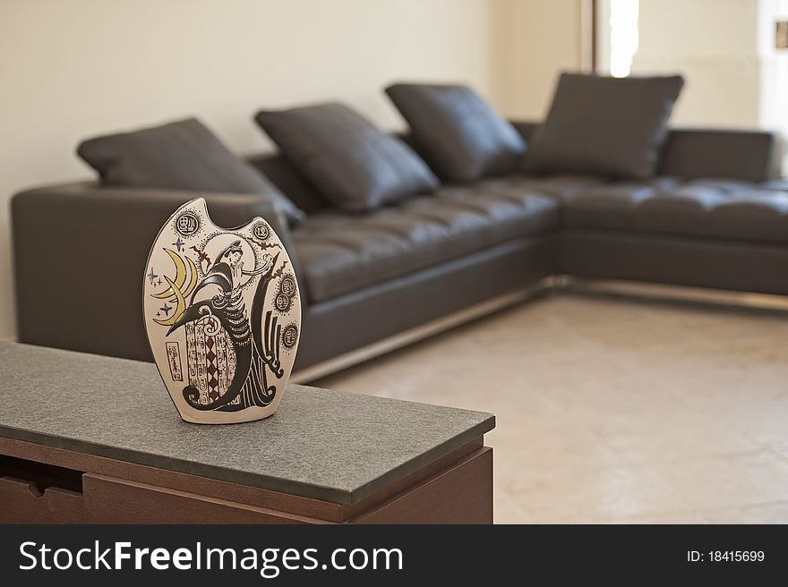 Ornate vase on a shelf in living room