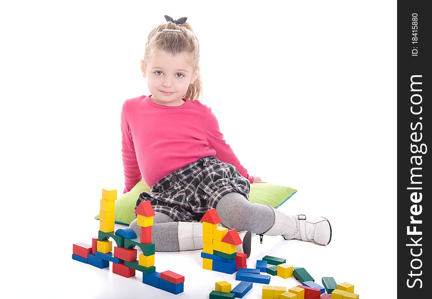 Little girl playing with cubes