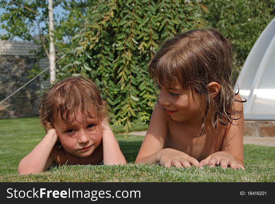 Two little girls playing in garden. Two little girls playing in garden