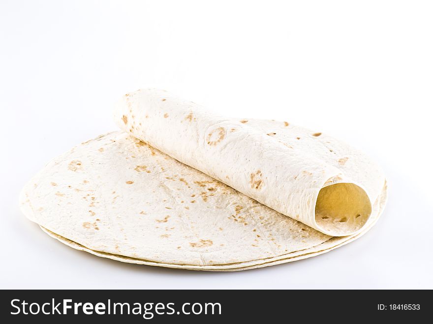 Stack of tortillas with one on the top - isolated