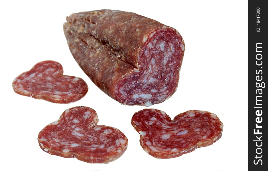 Slices of spicy smoked sausage isolated on white background