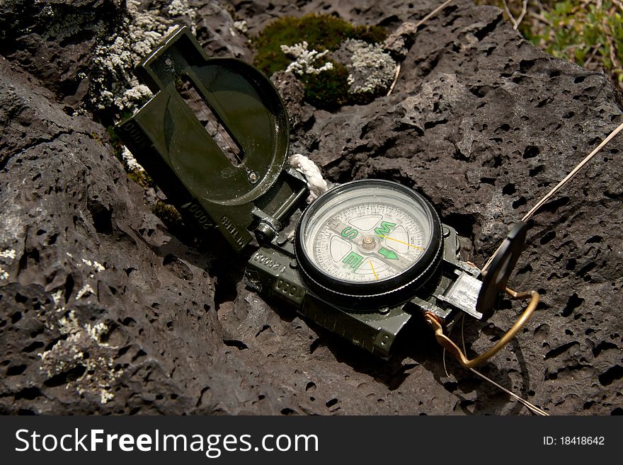 Modern Compass Lying On The Ground