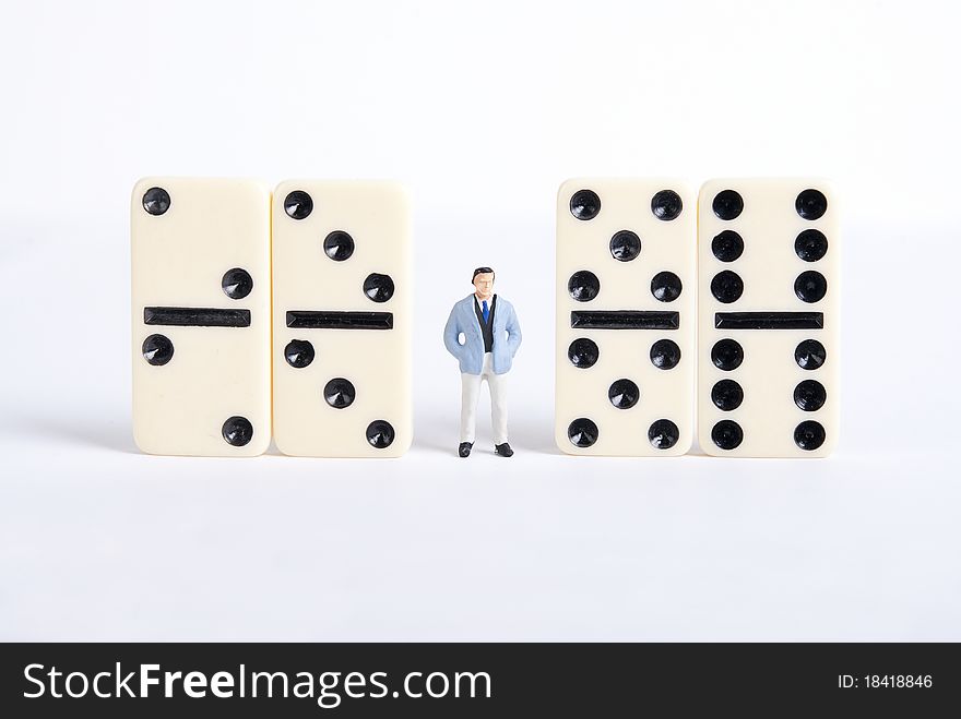 One man standing on pile of domino cubes