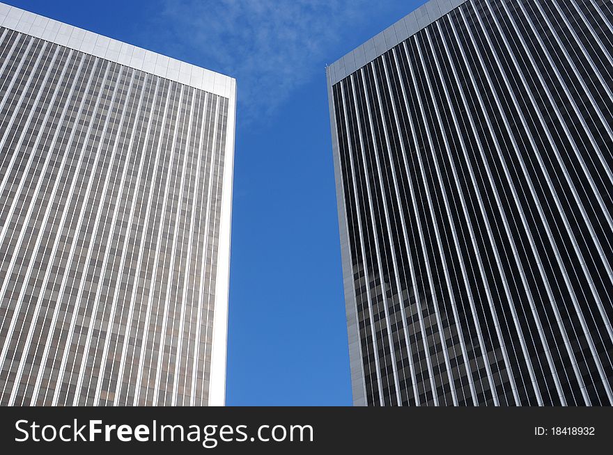 Twin tower office buildings in Century City with a blue sky, office environment, multi storied. Twin tower office buildings in Century City with a blue sky, office environment, multi storied