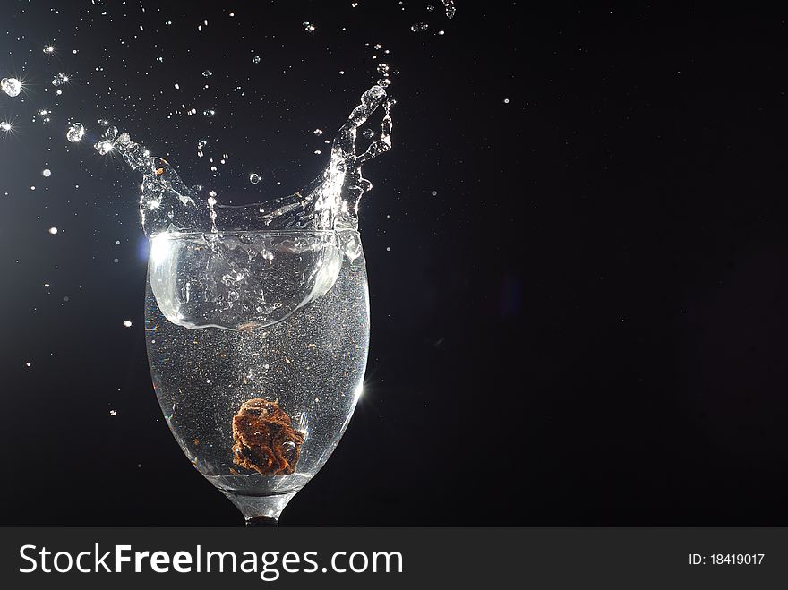 crown Plum splashing glass water