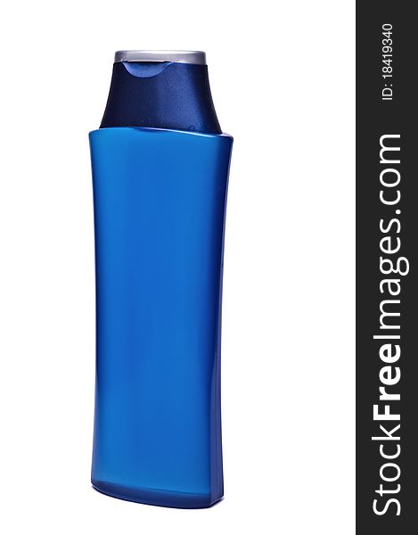 Dark blue plastic  bottle on a light background