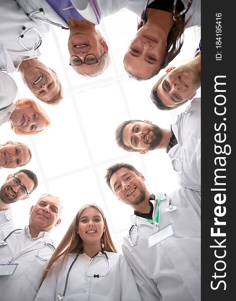 Close Up. Group Of Doctors Standing In A Circle And Looking At You