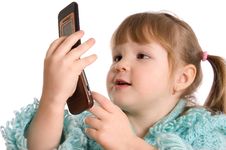 The Little Girl Speaks By Phone Royalty Free Stock Photography The Little Girl Speaks By Phone Royalty Free Stock Photography