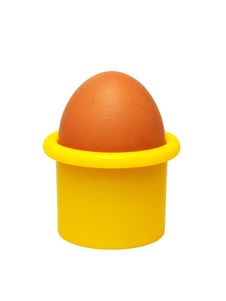 Egg In A Yellow Eggcup (isolated). Royalty Free Stock Images Egg In A Yellow Eggcup (isolated). Royalty Free Stock Images