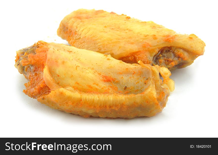 Close-up cooked chicken wings isolated on white