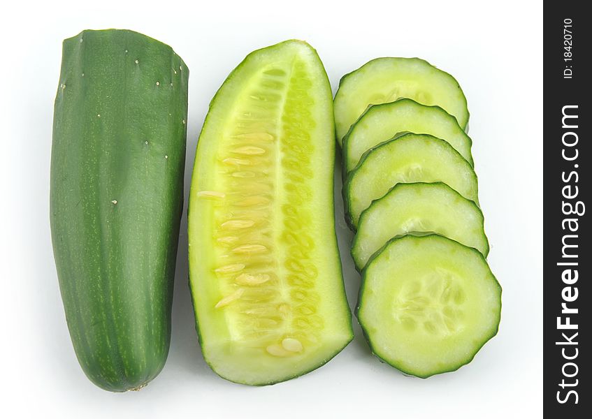 Cucumber and slices isolated over white background