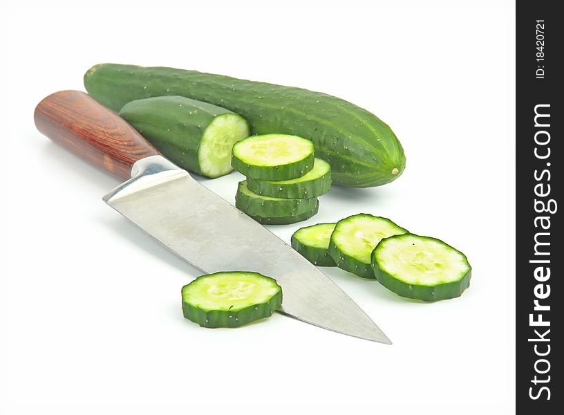 Cucumber and slices isolated over white background