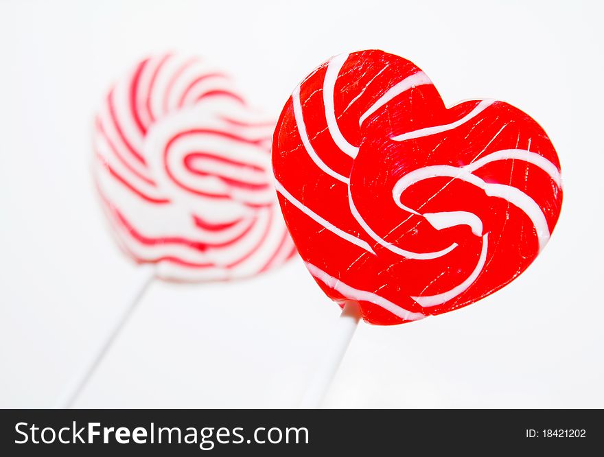 Retro style red , pink heart shape lollipop