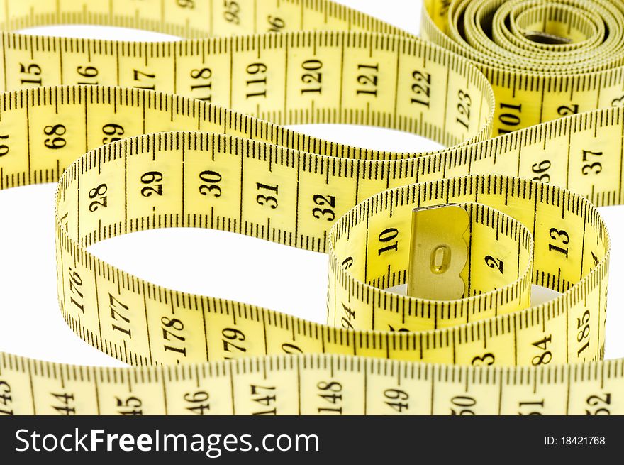 Yellow measuring tape isolated on white background