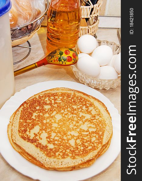 Plate with pancakes on a table closeup