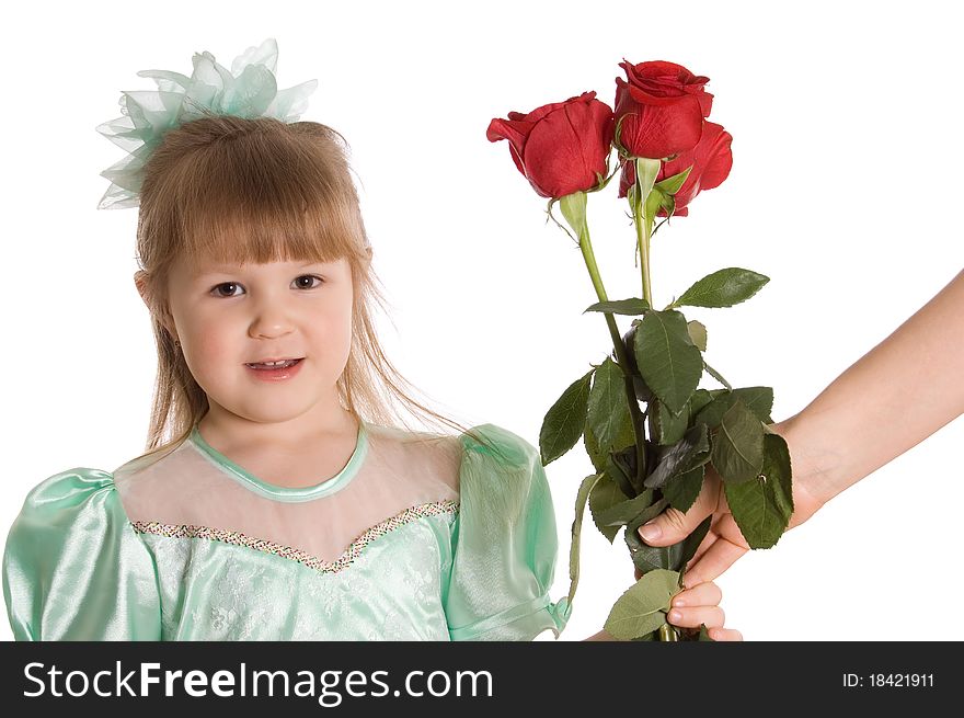 The little girl gives a bouquet of roses on white