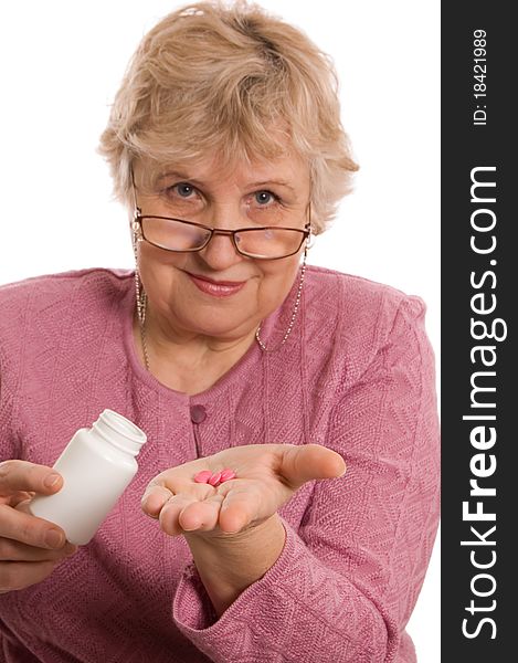 The elderly woman with tablets on white