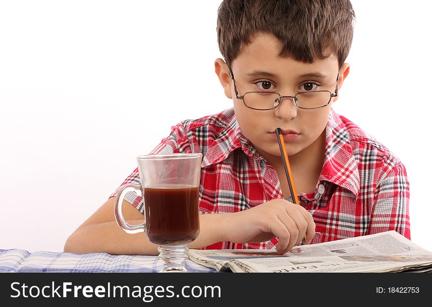 Kid in glasses reading newspaper. Kid in glasses reading newspaper
