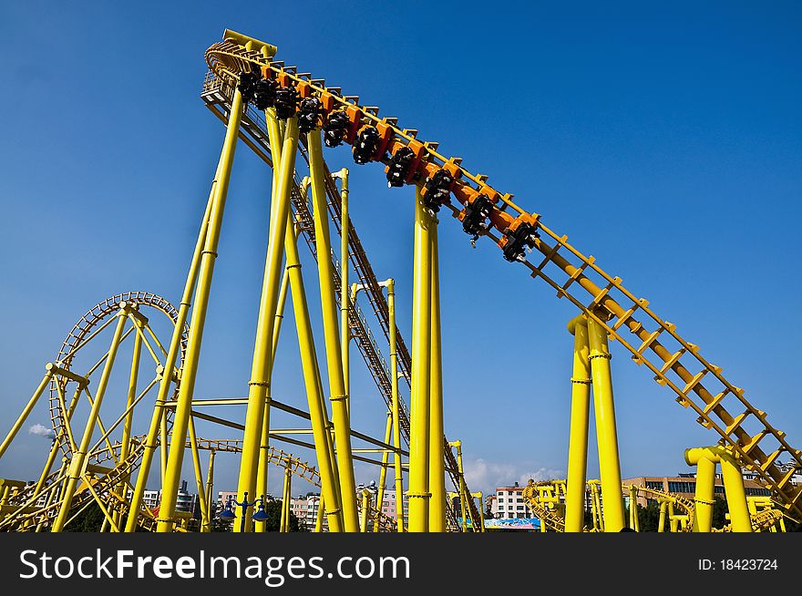 A roller Coaster train dropping down a steep hill