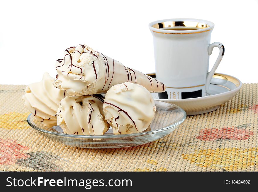 Dessert cake on a plate with a fork isolated on white background. Dessert cake on a plate with a fork isolated on white background