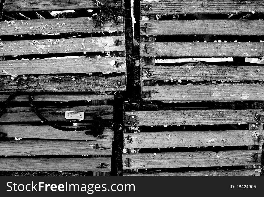 Black and white of old wooden shipping crates.