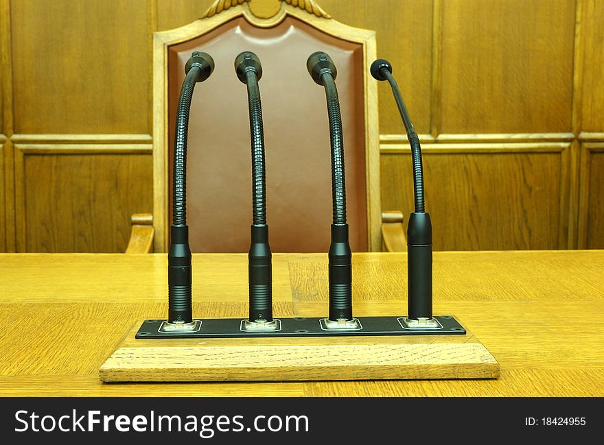 Photo of microphones in empty conference room