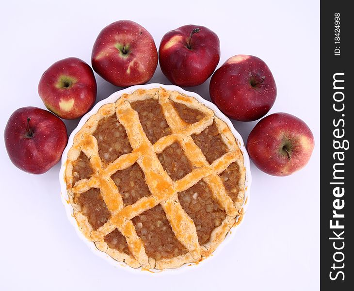 Apple Pie and some red apples on white background