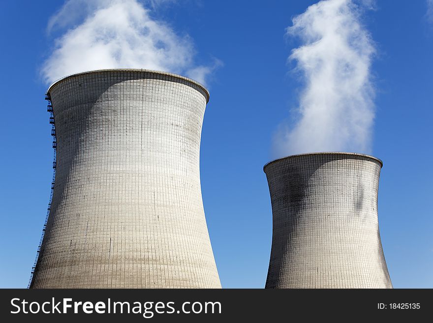 Two big smokestacks of nuclear industry