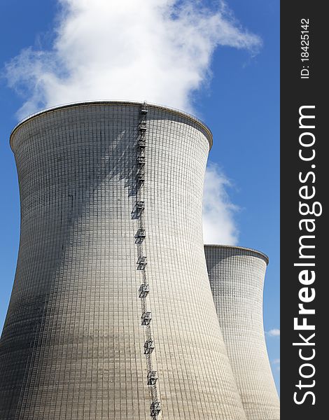 Smokestacks of nuclear industry with blue sky. Smokestacks of nuclear industry with blue sky