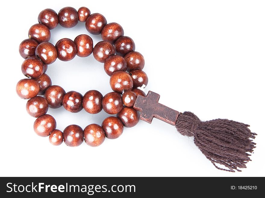 Wooden rosary isolated on white background close up