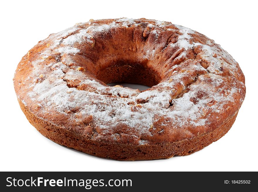 Cake with nuts, dusted with icing sugar isolated on a white background