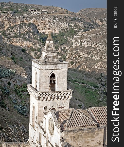 Church tower between the mountain in south Italy