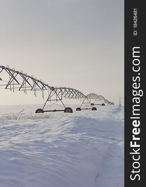 This image of the irrigation systme in the field was taken in NW Montana during a foggy winter early morning. This image of the irrigation systme in the field was taken in NW Montana during a foggy winter early morning.