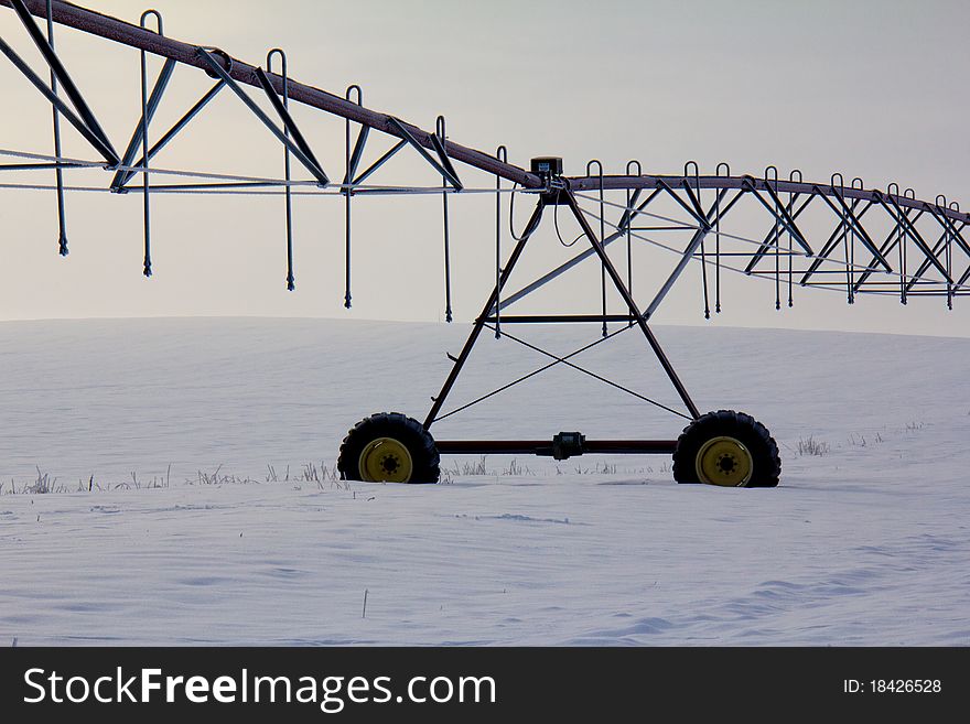 This image of the irrigation systme in the field was taken in NW Montana during a foggy winter early morning. This image of the irrigation systme in the field was taken in NW Montana during a foggy winter early morning.