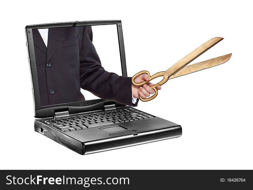 Black portable computer. Front view. Hand holding a scissors. Black portable computer. Front view. Hand holding a scissors.