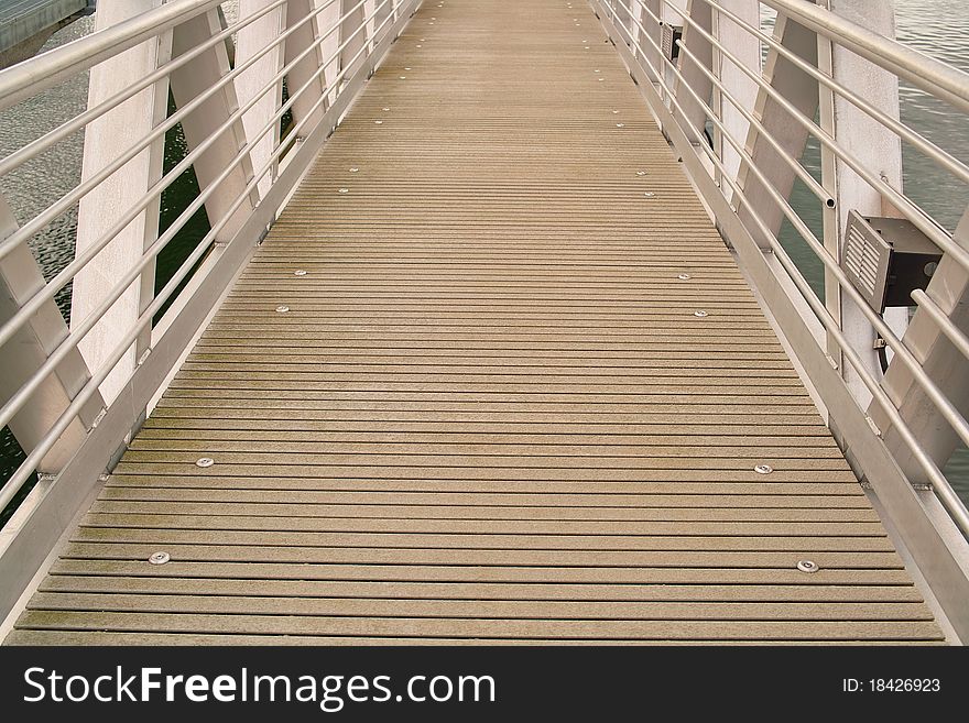 Horizontal view of a dock ramp with metal railings. Horizontal view of a dock ramp with metal railings.