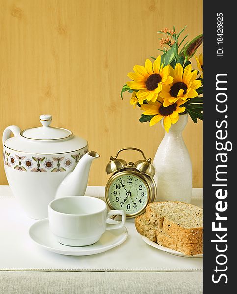 Alarm clock with cup and breads. Alarm clock with cup and breads