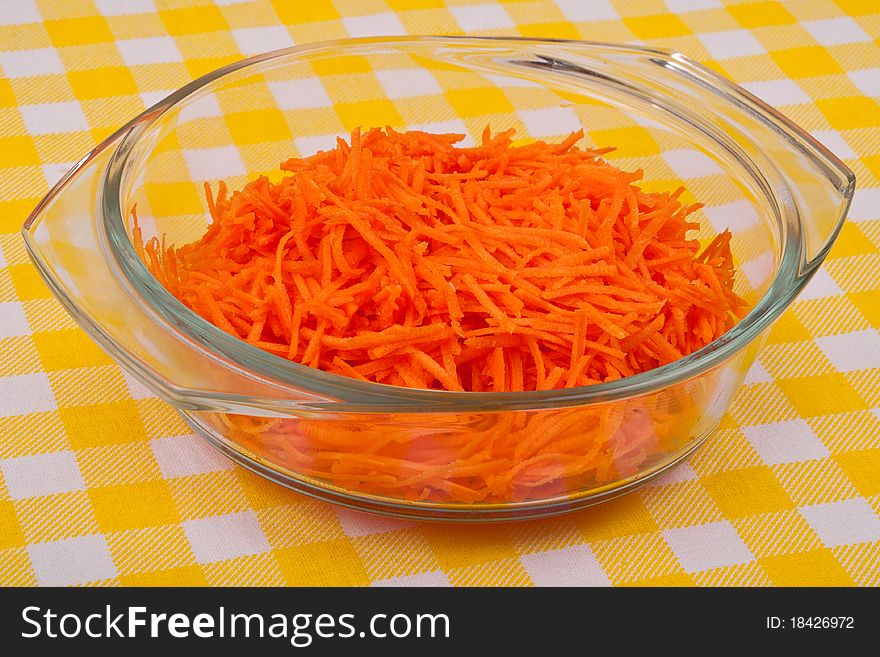 Sliced carrots in a glass bowl