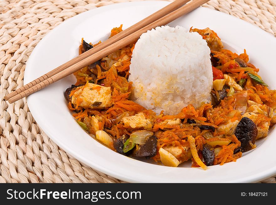 Chinese food with rice on a plate